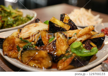 Stir-fried Potatoes, Eggplant, and Peppers. Chinese food 129708133