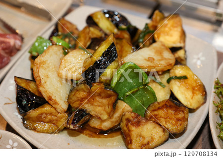 Stir-fried Potatoes, Eggplant, and Peppers. Chinese food 129708134