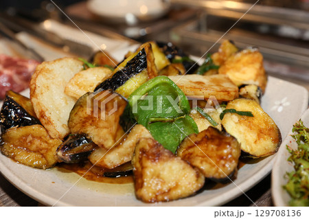 Stir-fried Potatoes, Eggplant, and Peppers. Chinese food 129708136