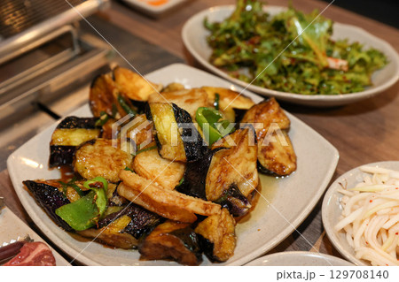 Stir-fried Potatoes, Eggplant, and Peppers. Chinese food 129708140