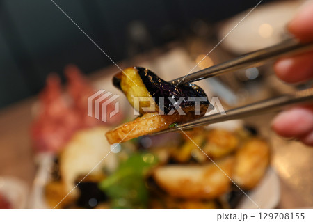 Stir-fried Potatoes, Eggplant, and Peppers. Chinese food 129708155