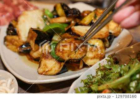 Stir-fried Potatoes, Eggplant, and Peppers. Chinese food 129708160
