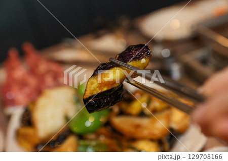 Stir-fried Potatoes, Eggplant, and Peppers. Chinese food 129708166