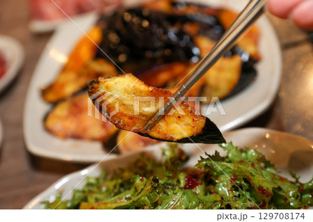 Stir-fried Potatoes, Eggplant, and Peppers. Chinese food 129708174