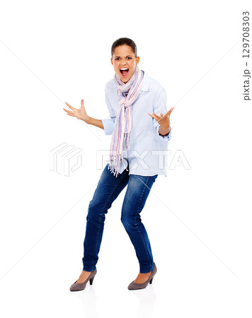Angry, frustrated and scream portrait of a woman with stress screaming about work isolated. White background, model and business employee screaming and standing with anger gesture and studio mockup 129708303