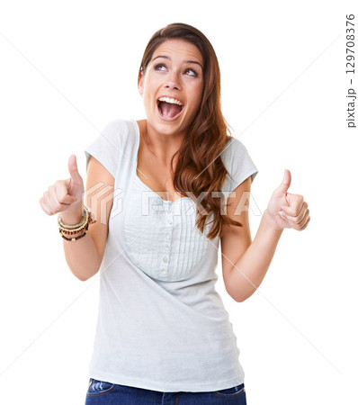 Thumbs up, surprise and young woman with success, celebrate and wow with smile against white background. Support, review and positive mindset with excited face, yes and agreement, OK with thank you 129708376