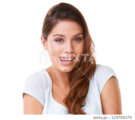 Portrait, tongue and woman flirting in studio, silly and playful against white background space. Face, funny and girl facial expression, comic and emoji, crazy and having fun while standing isolated 129708379