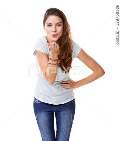 Blowing kiss, flirting and portrait of a woman with a smile for motivation, empowerment and care. Happiness, friendly and model with love, flirty body language and fun on a white background in studio Blowing kiss, flirting and portrait of a woman with a smile for motivation, empowerment and care. Happiness, friendly and model with love, flirty body language and fun on a white background in studio 129708386