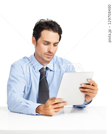 Thinking, digital tablet and businessman in studio for planning, internet and search on mockup. Management, online project and man busy with schedule while working on app for task, email or browsing 129708480