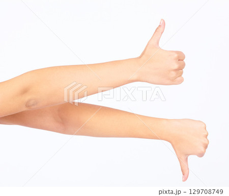 Hands, thumbs up and thumbs down in yes or no gesture for vote, poll or social media likes on white background. Sign language, finger or hand sign in agreement or disagreement for ASL website review. Hands, thumbs up and thumbs down in yes or no gesture for vote, poll or social media likes on white background. Sign language, finger or hand sign in agreement or disagreement for ASL website review. 129708749