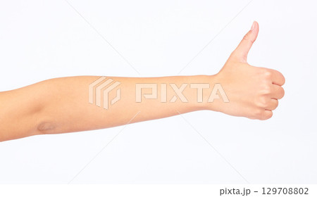 Woman, hand and thumbs up on studio background in success goals, vote support or opinion on white mockup backdrop. Zoom, model and yes finger gesture in thank you, winner news or good luck motivation 129708802