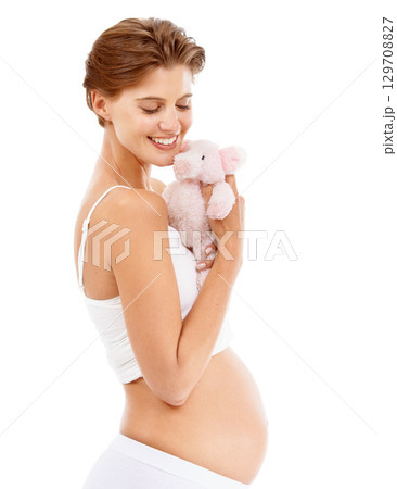 Pregnancy, baby teddy bear and happy woman with love and big stomach smile with child toy. Mothers love, pig doll and pregnant mama happiness with excited with about child care, motherhood and family Pregnancy, baby teddy bear and happy woman with love and big stomach smile with child toy. Mothers love, pig doll and pregnant mama happiness with excited with about child care, motherhood and family 129708827