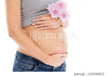 Pregnant, flower and woman in studio for wellness, health and organic skincare on white background. Daisy, pregnancy and pregnant woman hand on belly for care, beauty and product in nature on mockup 129708872