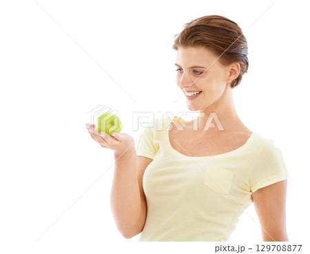 Diet, health and woman with an apple in a studio for nutrition, wellness and healthy weightloss. Natural, beauty and female model holding a fruit while isolated by white background with mockup space. Diet, health and woman with an apple in a studio for nutrition, wellness and healthy weightloss. Natural, beauty and female model holding a fruit while isolated by white background with mockup space. 129708877