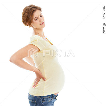 Woman, pregnant and back pain in studio by white background with frustrated face, hands and massage. Pregnant woman, future mother and stomach with injury, backache or isolated self care for wellness Woman, pregnant and back pain in studio by white background with frustrated face, hands and massage. Pregnant woman, future mother and stomach with injury, backache or isolated self care for wellness 129708879