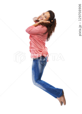 Music headphones, portrait and woman jump in studio isolated on a white background mock up. Jumping, energy and happy female with hifi headset streaming, listening or enjoying podcast, radio or audio 129708906
