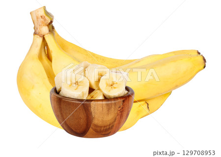 Bunch of ripe bananas with slices in wooden bowl isolated on white background Bunch of ripe bananas with slices in wooden bowl isolated on white background 129708953