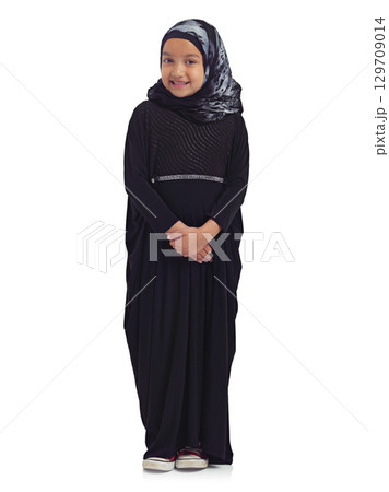 Islamic clothes, young child and smile standing in white background for culture happiness, religion awareness or empowerment. Muslim girl, happy and religious fashion or hijab isolated in studio Islamic clothes, young child and smile standing in white background for culture happiness, religion awareness or empowerment. Muslim girl, happy and religious fashion or hijab isolated in studio 129709014