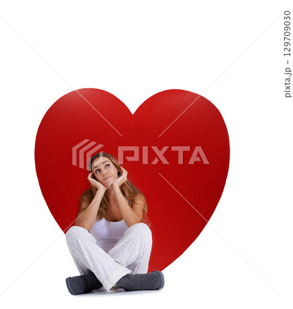 Love, thinking and woman with studio heart, romantic product or emoji icon for Valentines Day holiday. Beauty, big red object or relax model girl with care symbol and day dreaming on white background Love, thinking and woman with studio heart, romantic product or emoji icon for Valentines Day holiday. Beauty, big red object or relax model girl with care symbol and day dreaming on white background 129709030