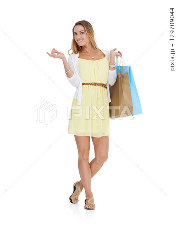 Shopping bag, studio and woman pointing for marketing, promotion or advertising of sale or discount deal. Shopping, wealth and rich customer with product placement on white background or mockup space 129709044