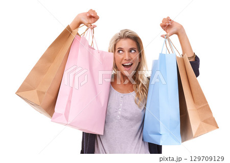 Fashion, wow or woman with shopping bag, clothes or luxury products in studio on white background. Excited, retail or happy girl customer with designer brands on sale, discount or promotional offer Fashion, wow or woman with shopping bag, clothes or luxury products in studio on white background. Excited, retail or happy girl customer with designer brands on sale, discount or promotional offer 129709129