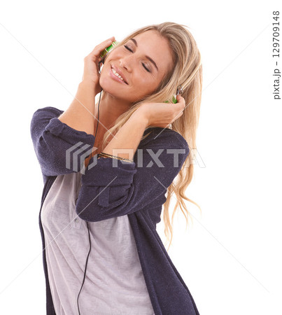 Music, smile or happy woman in studio listening to radio audio or song playlist on white background. Headphones, eyes closed or beautiful girl enjoys dancing, relaxing or streaming a calm sound track 129709148
