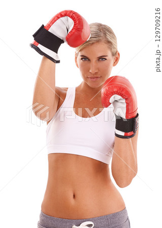 Sports, fitness and portrait of woman with boxing gloves, confidence and motivation to box, isolated on white background. Boxing, exercise and empowerment, female boxer ready for challenge in studio. Sports, fitness and portrait of woman with boxing gloves, confidence and motivation to box, isolated on white background. Boxing, exercise and empowerment, female boxer ready for challenge in studio. 129709216