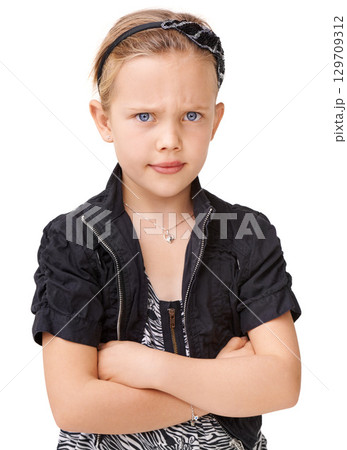 Portrait, angry and children with an unhappy girl standing arms crossed in studio isolated on a white background. Kids, attitude and frown with a female child looking moody, annoyed or frustarted 129709312