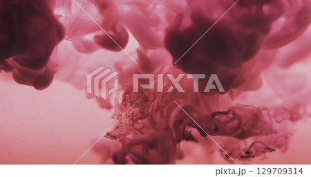 Smoke explosion. Haze flow. Purple paint blobs dissolving on color background. Art pigment wave fog spilling in water abstract cloud. 129709314