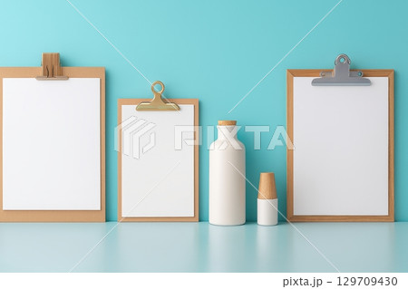 Set of clipboards and a bottle are displayed on a blue background 129709430