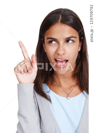 Young woman, thinking and finger with idea, solution or plan against white studio background. Isolated female pointing hand up to solve problem or in thought for light bulb moment on white background 129709782