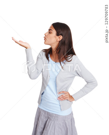 Hand, kiss and advertising with a business woman in studio isolated on a white background for marketing. Product, brand and logo with an attractive young female kissing blank space for branding 129709783