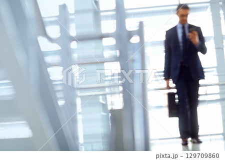 Blurred, travel or business man with phone for invest strategy, finance growth or financial review. CEO, airport or manager with smartphone for planning, data analysis or economy data web research 129709860