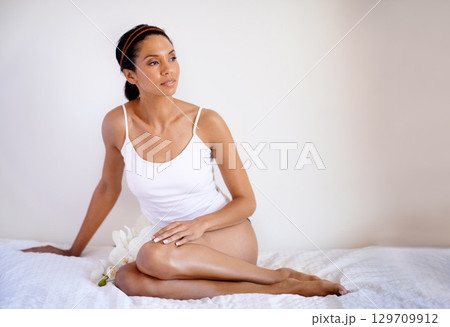 Lingerie, body and woman in bedroom for skincare, beauty and cosmetics marketing of natural shine and glow. Sexy woman relax, thinking of self care, self love and dermatology skin care on white wall 129709912