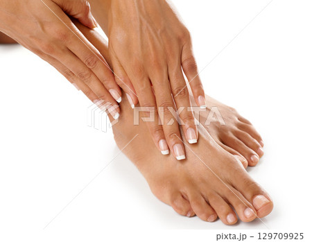 Woman, hands and feet with beauty and skincare, manicure and pedicure spa treatment zoom with nails. Natural cosmetics, organic cosmetic care and wellness with healthy skin against white background Woman, hands and feet with beauty and skincare, manicure and pedicure spa treatment zoom with nails. Natural cosmetics, organic cosmetic care and wellness with healthy skin against white background 129709925