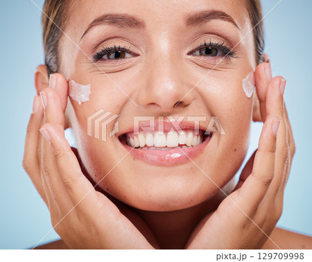 Beauty, face and cream with skincare and woman with hands frame, glow and shine with cosmetic moisturizer against studio background. Healthy skin, lotion and portrait smile with cosmetics mockup. 129709998