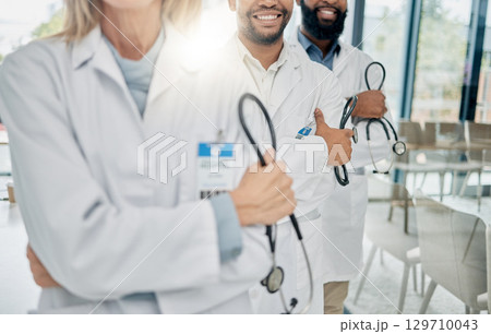 Healthcare, team and hands of doctors with stethoscope for trust, support and insurance in hospital. Teamwork, leadership and group of medical workers with tools for medicine, wellness and cardiology 129710043