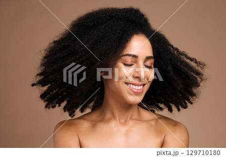Shake hair, afro and face of black woman with clean shampoo hair care, luxury skincare cosmetics and natural facial makeup. Spa salon, trichology and happy African model with aesthetic healthy hair Shake hair, afro and face of black woman with clean shampoo hair care, luxury skincare cosmetics and natural facial makeup. Spa salon, trichology and happy African model with aesthetic healthy hair 129710180
