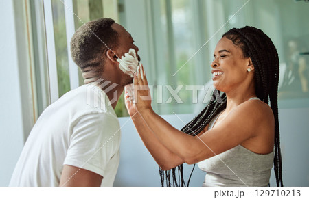 Skincare, happy couple in bathroom and shaving face with at home facial product for male facial treatment. Laughing together in home, natural beauty and girlfriend helping black man with application Skincare, happy couple in bathroom and shaving face with at home facial product for male facial treatment. Laughing together in home, natural beauty and girlfriend helping black man with application 129710213