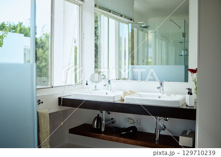 Mirror, bathroom and toilet interior in home, house and luxury hotel for beauty, skincare and cleaning. Reflection in restroom, design and building architecture, background and empty apartment space 129710239