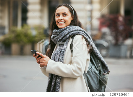 Walking, phone and woman travel on city sidewalk, street road or on holiday adventure journey In London UK. Mobile smartphone, England and girl search gps location with digital app, compass or map 129710464