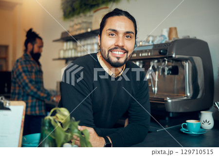 Portrait, coffee shop and barista with a man at work behind the counter in a cafe or restaurant as a waiter. Manager, retail or small business with a male employee working in a cafeteria for service Portrait, coffee shop and barista with a man at work behind the counter in a cafe or restaurant as a waiter. Manager, retail or small business with a male employee working in a cafeteria for service 129710515