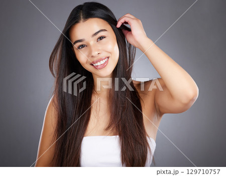 Hair care woman, smile and studio portrait for healthy cosmetic treatment, style and happy by backdrop. Model, hair health and natural shine with beauty, wellness and makeup glow by studio background 129710757