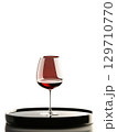 Delicate Pinot Noir glass, cradling light red wine, isolated on transparent, dynamic stem, reflections, creative dish, 129710770