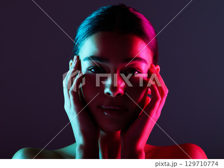 Beauty, neon shadow light and portrait of woman with dark lighting, facial cosmetics and skincare glow. Luxury studio makeup, aesthetic creativity and face model with creative pink blue color design Beauty, neon shadow light and portrait of woman with dark lighting, facial cosmetics and skincare glow. Luxury studio makeup, aesthetic creativity and face model with creative pink blue color design 129710774