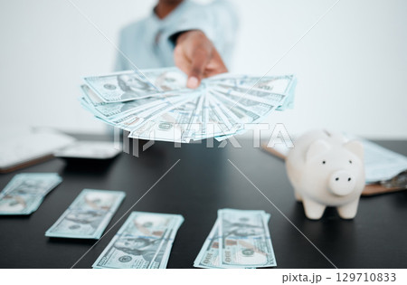Hand, dollars and black woman with money for payment, financial investment or bribe in office. Currency, finance or business woman offering cash for banking, deal or savings, loan or money laundering Hand, dollars and black woman with money for payment, financial investment or bribe in office. Currency, finance or business woman offering cash for banking, deal or savings, loan or money laundering 129710833