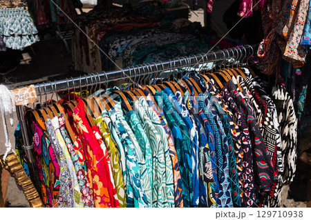 colorful vintage clothings on fashion flea market - second hand clothes , 129710938