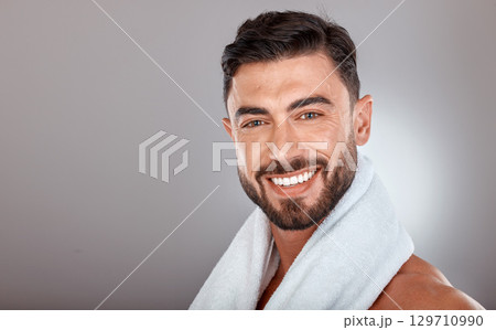 Man with towel, beauty and face with skincare, hygiene and self care portrait against studio background. Grooming, skin and glow with cosmetic mockup, facial wellness and clean teeth with smile Man with towel, beauty and face with skincare, hygiene and self care portrait against studio background. Grooming, skin and glow with cosmetic mockup, facial wellness and clean teeth with smile 129710990