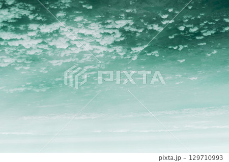Sky and clouds background from above on Earth 129710993