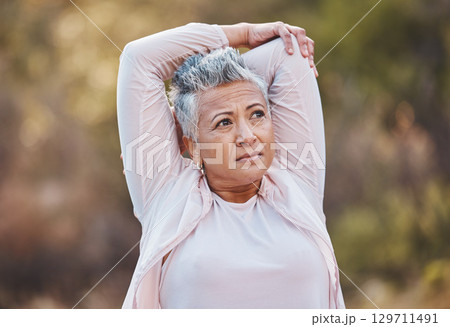Fitness, stretching or old woman in nature thinking of body goals starts training, exercise or workout in New Zealand. Wellness, relax or healthy senior person with motivation, resilience or vision Fitness, stretching or old woman in nature thinking of body goals starts training, exercise or workout in New Zealand. Wellness, relax or healthy senior person with motivation, resilience or vision 129711491